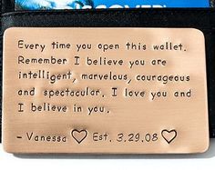 a metal plaque that has been placed on top of a wallet with the words, stamped metal