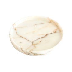 a white marble dish with gold lines on it's sides, against a white background