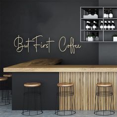 an empty bar with stools in front of it and the words eat drink enjoy written on the wall