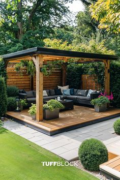 a wooden gazebo surrounded by greenery and potted plants