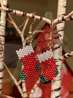 Christmas Stocking Earrings! These cute little earrings are made with genuine Miyuki seed beads and artistically hand woven using Peyote stitching. This is a very unique hand crafted Holiday item which will receive lots of compliments! These wonderful earrings are hand made using the highest quality Japanese Miyuki glass seed beads in red, white and green colors woven together using the brick stitch technique. Miyuki Japanese glass seed beads are world class seed beads known for their brilliance, quality and perfect uniform shape. These pretty earrings come in a gift bag and will make a wonderful hand made unique gift. If you have any questions about this item, please don't hesitate to contact me. Thank you for visiting my shop. Vintage Christmas Earrings, Seed Bead Projects, Christmas Tree Earrings, Christmas Bead, Beaded Earrings Patterns, Stitch Christmas, The Brick, Holiday Stockings, Holiday Earring