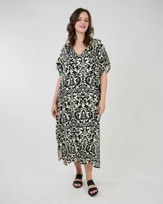 The Helen Caftan by Shannon Passero Style#: 5095 One Size Measurement Across Chest: 32" Length from Shoulder: 50" 100% Rayon-Woven Our small group of prints are made with care by our Women’s Co-Op in Thailand.The prints are limited runs to be mindful of limiting our fabric waste.Designed in Canada | Made in Thailand Black Printed Short Sleeve Kaftan, Black Printed V-neck Kaftan, Black Printed Kaftan With Short Sleeves, Black Printed Tunic Kaftan, Black Floral Print Maxi Kaftan, Casual Printed Patterned Kaftan, Casual Patterned Printed Kaftan, Black Spring Kaftan With Short Sleeves, Casual V-neck Patterned Kaftan