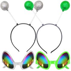 three pairs of sunglasses with green and silver balls attached to the sides, one in front of