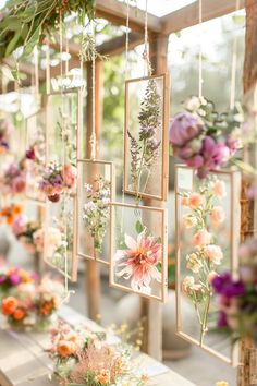 an arrangement of flowers hanging from the ceiling