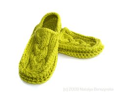 a pair of knitted slippers sitting on top of each other