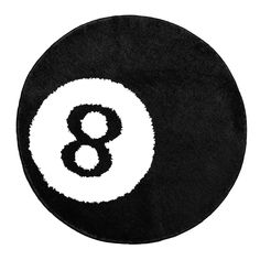 a black and white round rug with the number eight on it