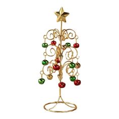 a gold christmas tree with ornaments on it's base and a star hanging from the top