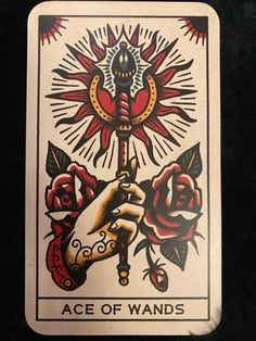 an ace of wands playing card with roses on it