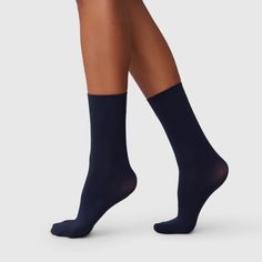 Ingrid navy 60 denier ankle socks. These navy ankle socks are semi-opaque with a broad cuff and toe reinforcement. Designed in Sweden and made in Italy from recycled yarn. Everyone needs these classic navy socks in their year-round wardrobe! Here are the reasons why you’ll love these navy ankle socks as much as we do: 60 denier socks Semi-opaque Soft and broad cuff Toe reinforcement Knitted from recycled yarn 100% emission free production Made in Italy 92% recycled polyamide, 8% elastane Please Cashmere Navy Socks, Navy Socks, Round Wardrobe, Recycled Yarn, Shoe Boutique, Navy Women, Ankle Socks, Black Heels, Socks Women