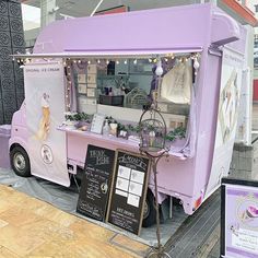 an ice cream truck parked in front of a building