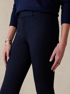 Empowerment entrusted to a classic.  This customer favorited Bi-Stretch fabric is engineered with high stretch and recovery for a smooth, supportive fit that won't lose its shape.  MID-RISE SKINNY FIT: Formerly called the Modern Sloan, this pant has Classic Stretch Bottoms With Contoured Waistband, Classic Mid-rise Bottoms With Seam Detailing, Navy Classic Stretch Bottoms, Classic Navy Stretch Bottoms, Navy Stretch Pants For Business Casual, Navy Fitted Elastane Pants, Solid Color Activewear With Comfort Waistband For Work, Navy Fitted Elastane Bottoms, Tapered Leg Elastane Activewear