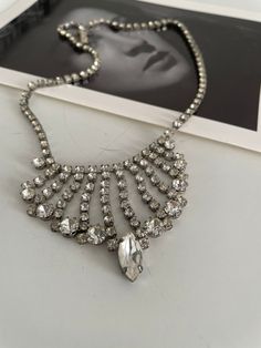 "Vintage 1950s  rhinestone  neckalce. ★ Measurements: length total 16.5 \" ★ Label/Designer: n/a ★ Condition: excellent ✩ visit the shop ✩ https://www.etsy.com/shop/Themagicstories2?ref=seller-platform-mcnav Thanks!" Vintage Crystal Necklace With Sparkling Stones, Vintage Crystal Rhinestone Necklace, Vintage Crystal Necklaces For Party, Vintage Sparkling Stones Necklaces For Party, Vintage Crystal Rhinestone Costume Necklace, Vintage Rhinestone Party Necklace, Vintage Crystal Rhinestone Necklace For Party, Crystal Rhinestone Necklace For Vintage Events, Iridescent Necklace