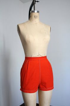 "Vibrant orange high waisted pin up style shorts from the 1950s. Cotton shorts with high waist and pockets! Metal zipper up the back.  Label: Alfred Paguette  Measurements: { xsmall } Waist: 24\"  Hips: 35\" Length: 13\" Rise: 13\" Condition: great vintage condition with a few teeny marks and minor signs of wear - sold as found. washed and ready to wear ☆Shop more☆ http://www.trunkofdresses.com/" Retro Orange Bottoms With Pockets, Orange Fitted High-waisted Shorts, Fitted Orange High-waisted Shorts, Fitted High-waisted Orange Shorts, Retro Orange Summer Shorts, Orange Retro Summer Shorts, High Waist Fitted Orange Shorts, Fitted Orange Shorts With Built-in Liner, Fitted Orange Shorts With Built-in Shorts