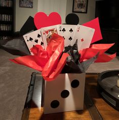 a box filled with playing cards on top of a table