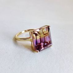 ITEM DESCRIPTION: --> The ring is made from Solid 14K Yellow Gold. Gemstone used is absolutely natural and ethically sourced. --> Ametrine is naturally occurring gemstone which is a unique combination of Amethyst and Citrine. --> Ametrine in Emerald Cut is studded on it with utmost precision. Gem: Ametrine Gem size: 12.3x14mm Gem weight: 12.18 carat Gold purity: 14K (58.33% approx.) Gold weight: 2.40 grams Gross weight of ring: 4.84 grams >>The Gold purity is guaranteed and it comes with authent Ametrine Engagement Ring, Elegant Multi-stone Amethyst Ring Gift, Oval Ruby Engagement Ring, Luxury Gold Multi-stone Amethyst Ring, Gold Luxury Amethyst Multi-stone Ring, Luxury Gold Amethyst Multi-stone Ring, Ametrine Jewelry, Ametrine Ring, Amethyst Rings