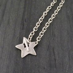 Hammered silver star pendant with front toggle on chunky silver link chain - Choose from matte silver or shiny silver - Silver plated pewter pendant and chain - Star measures 1.5" each way - 18" or 16" length - choose in options Here is the link to the matching bracelets: https://mosaicsunstudio.etsy.com/listing/816234417 Chunky Star Necklace, Silver Star Necklace, Hot Clothes, House Items, Star Necklace Silver, Silver Link Chain, Mixed Metal Earrings, Pewter Pendant, Necklace Chunky