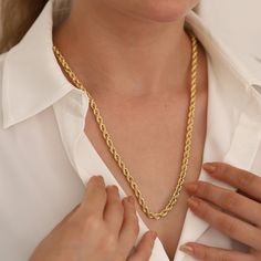 "With the 14k Gold 5mm Rope Chain Necklace, you can enter the realm of timeless beauty. This jewelry piece, a combination of classic elegance and contemporary refinement, crosses decades to provide a timeless accessory for everybody.  The exquisite twist of the rope chain, steeped in symbolism, is meticulously made from 14k gold, displaying not only visual attraction but also unsurpassed quality. The necklace's unisex design seamlessly compliments many styles, giving a touch of refinement to any appearance.  This necklace becomes a canvas for personalized expression, with a choice of six widths, giving a precise fit that fits with personal tastes. The 14k Gold 5mm Rope Chain Necklace exemplifies the enduring grace of vintage-inspired design blended with modern elegance, whether celebrating Elegant Rope Chain Link Necklace As Gift, Classic Rope Chain Link Necklace For Gift, Elegant Tarnish Resistant Rope Chain Necklace Gift, Classic Gold Rope Chain Necklace Gift, Classic Rope Chain Necklace For Anniversary, Elegant Rope Chain Necklace For Anniversary, Elegant Anniversary Rope Chain Necklace, Twisted Chain, Gold Chain Design