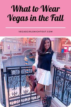 a woman standing on a balcony with the words what to wear vegas in the fall