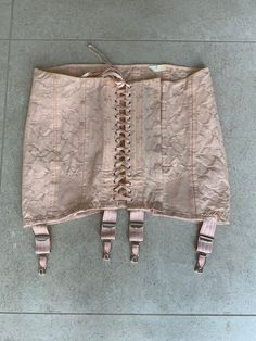 Vintage peach pink cotton jacquard Spirella girdle corset. Cotton front laces. Boned section beside front lacing. Hook and eye fastening. 4 non-removable suspenders. Adjustable waist up to 35 inches and hips up to 40 inches approx. Excellent vintage condition.  Barely worn and has been in storage for many years. Dimensions taken flat across width of girdle ( laces tied tightly) Waist.      33. Inches Hips.        36.Inches Front Length.   11.5. Inches Back Length.    13 Inches The girdle is adju 1950s Garter Belt, 1940 Clothing, White Garter Belt Vintage Magazine, 1940s Lingerie, Directoire Knickers, Vintage Girdle, 1950s Lingerie, Hip Ups, Peach Pink