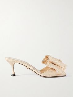 MACH & MACH's 'Cadeau' mules have such a summery feel, all thanks to their woven raffia construction. Designed with round toes, they're adorned with an oversized double-bow at the straps and rest on 65mm heels that offer comfortable lift. Slip yours on with jeans and sundresses alike. Elegant Beige Mules For Vacation, Luxury Straw Sandals For Summer, Luxury Summer Straw Sandals, Elegant Natural Color Summer Heels, Elegant Beige Straw Sandals, Chic Natural Mules For Spring, Elegant Straw Heels For Vacation, Elegant Summer Straw Heels, Beige Formal Mules For Summer