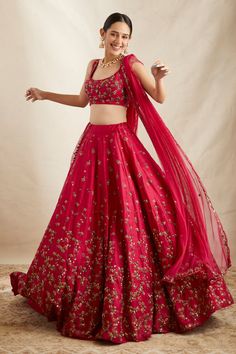 Carmine pink attached can can lehenga with floral embroidery in sequin, cutdana and nakshi. Paired with embroidered, padded blouse and embroidered dupatta.
Components: 3
Pattern: Embroidered
Type Of Work: Nakshi, Cutdana, Sitara
Neckline: Scoop
Sleeve Type: Sleeveless
Fabric: Lehenga: Raw Silk, Blouse and Dupatta: Net
Color: Pink
Other Details: 
Floral pattern
Lehenga Length: 44 inches
Occasion: Bride,Wedding - Aza Fashions Astha Narang, Pink Lehenga, Embroidered Lehenga, Fashion App, Floral Bridal, Bridal Set, Bridal Lehenga, Embroidered Silk, Raw Silk