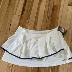 Super Cute White Nike Tennis Skirt, Brand New With Tags Never Worn. No Stains Hoes Or Pilling, Just Sadly Too Big For Me, Got It On Sale Thinking It Would Eventually Fit Me But Sadly Still Is Too Big And Getting Tired Of Holding On To It. Please Let Me Know If You Have Any Questions At All, I Am Here To Help:) Cute Tennis Skirts, Nike White Skort For Spring, Nike White Tennis Skirt For Spring, Nike White Fitted Tennis Skirt, Fitted White Nike Tennis Skirt, Nike White Lined Skirt, Nike White Skirt For Spring, Nike White Casual Skort, Fitted White Nike Skirt