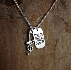 Excited to share the latest addition to my #etsy shop: MUSIC NEVER LIES, Music Teacher, Music Lover, Musician, Stamped Jewelry, Custom Necklace, Animal Rescue, Keepsake Jewelry, Ilovemydogjewelry http://etsy.me/2ASNJst #jewelry #necklace #silver #musician #musicteacher Kinds Of Love, Community Volunteering, I Love My Dog, Handmade Sellers, Dog Jewelry, Bangle Bracelets With Charms, Keepsake Jewelry, Music Teacher, Stamped Jewelry