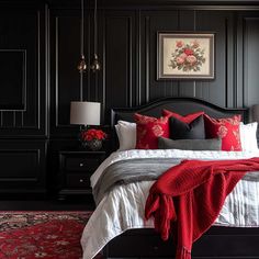 a bedroom with black walls and red accents