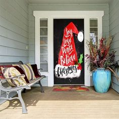 a front porch decorated for christmas with holiday decorations