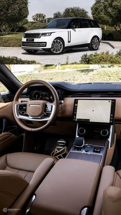 the interior and dashboard of a range rover in front of a white suv with brown leather seats