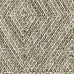 a close up view of the texture of an upholstered carpet with grey and white herring