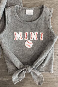 Mom & child tops both feature a chenille patch on the front Tank sleeves make it a perfect pick all season long Ultra-soft material for comfort & ease You and your little one will be the cutest at the ballpark in these "Mama & Mini" Gray Chenille Patch Tops. The top features a baseball chenille patch on the front and is made from soft, breathable fabric that will keep her comfy during all adventures. She can pair it with a variety of SIP bottoms & our booties for the perfect look! Little ones lo Patch Top, Chenille Patch, Children Top, Mom Kid, Fit Mom, Boot Sandals, Things To Make, Soft Material, The Cutest