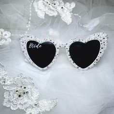 Custom white pearl rhinestone sunglasses for the Bride! Very popular for weddings, bachelorette parties, and honeymoons. Makes a perfect and unique gift for the Bride-to-be. A gorgeous personal touch to add to a memorable bachelorette trip and wedding day.  Each pair is made-to-order and 100% unique from any other; no two pairs are the exact same in terms of placement of the pearls and rhinestones. Feel free to message me with any questions!! <3 Elegant White Sunglasses For Wedding, Elegant Summer Wedding Sunglasses, Bride Sunglasses Wedding, Elegant White Wedding Sunglasses, Bride Sunglasses Diy, Elegant Valentine's Day Party Sunglasses, Heart Sunglasses Bride, Bridal Heart Sunglasses, Bride Sunglasses