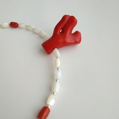 < Mother of Pearl Necklace with red coral pendant > Like 99% of the coral on the market these days, this coral has been dyed. I use bamboo coral which is not endangered or threatened in any way, unlike natural pink or red coral (the production of which is forbidden almost everywhere in the world). Bamboo coral doesn't mean it's not organic. Every bead of it has a distinctive and beautiful coral pattern. My jewelry dyed with high quality paint. It's safe for your health and the paint does n Coral Red Coral Necklace For Gifts, Coral Red Coral Necklace Gift, Polished Coral Beaded Necklaces, Coral Red Beaded Necklaces With Polished Beads, Hand-strung Red Coral Jewelry In Coral Color, Red Coral Necklaces For Beach, Coral Beaded Necklace In Red Coral, Beaded Red Coral Necklaces In Coral Color, Hand-strung Red Coral Jewelry