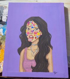 a painting of a woman with flowers painted on her face