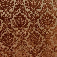 a brown and gold wallpaper with an ornate design on it's surface,