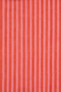 an orange and red striped fabric with vertical stripes