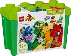 a green box filled with lots of colorful legos