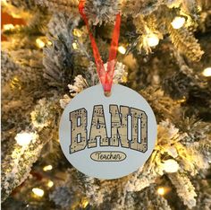 a christmas ornament hanging from the top of a tree