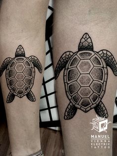 two black and white tattoos on the legs of people, one with a turtle in it's shell