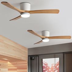 three wooden ceiling fans mounted to the ceiling