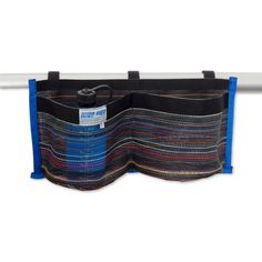 a multicolored bag hanging from a white rail with blue handles and two pockets