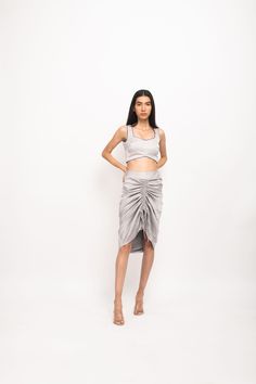 Grey bustier with blue pipin throughout and grey skirt with rouching at the front.Party Wear, Casual, Office Wear, Day Wear, Holiday Wear Fabric : Bemberg Modal Silk Grey-Blue Color Butter Crepe Lining Colorblocked Pattern 7-14 days Delivery Dry clean only Gray Fitted Party Skirt, Fitted Gray Skirt For Party, Gray Fitted Skirt For Party, Party Wear Casual, Lucknowi Kurta, Blue Block Heels, Chikankari Lehenga, Casual Office Wear, Half Jacket