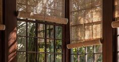 an open window with bamboo shades on it