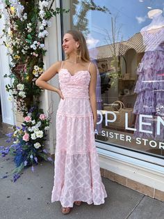 Pink Hoco Dress: Looking for the perfect dress to dazzle at a summer wedding? Meet our Estelle Maxi Dress—a flirty, light pink floral dress that’s sure to turn heads. With its tiered skirt and adjustable spaghetti straps, it’s a charming choice for a day of celebration. The sweetheart neckline and bodycon fit highlight your silhouette, while the textured material adds a touch of playful elegance. Just slip on a pair of baby heels for a delicate, summer-ready look. Pink Tiered Dress With Adjustable Straps, Feminine Spaghetti Strap Prom Dresses, Spring Bridesmaid Dress With Ruffled Straps, Pink Dress With Adjustable Straps And Sweetheart Neckline, Pink Dress With Sweetheart Neckline And Adjustable Straps, Spring Prom Dress With Ruffled Straps, Spring Bridesmaid Tiered Dresses, Spring Tiered Bridesmaid Dresses, Pink Brunch Dress With Adjustable Straps