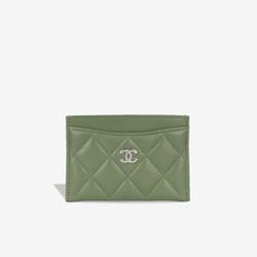 The classic mini card holder from Chanel is the ideal luxurious accessory to add into any of your handbags. Featuring several slots for use of cards, this holder will keep everything secure and safe. SPL Exterior Olive green lambskin leather Silver hardware Four card slots Unused condition Serial code 31XXXXXX - Year of Production 2021 Sold with dustbag and card only SPL Height 7cm Width 11cm Depth 0.5cm Card Holder Purse, Classic Card, Cross Bag, Rose Gold Hardware, New Green, Timeless Handbag, Wallet Accessories, Classic Mini, Leather Silver