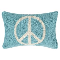 a blue pillow with a peace sign on it