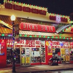 a store front with christmas lights and decorations