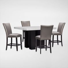 a table with four chairs around it and a white marble top in front of two black barstools