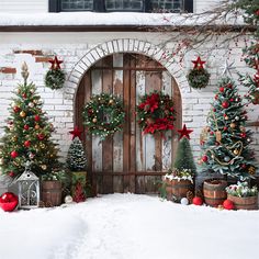 christmas trees and wreaths in front of a door